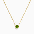 The 14K Yellow Gold Peridot Bezel Pendant with Paperclip Chain features elongated links and a round, faceted peridot set in a simple bezel setting.