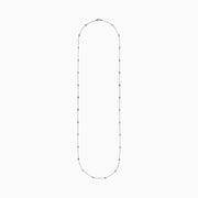 The 14K White Gold 36 Inch 3.00ct Diamond Station Necklace features a white gold chain with evenly spaced round bezel-set diamonds for a timeless, elegant look.