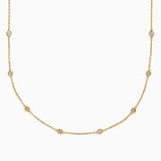The 14K Yellow Gold 36 Inch 2.00ct Diamond Station Necklace features bezel-set round diamonds spaced evenly along a delicate gold chain, shown against a white background.