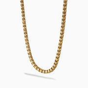 The 14K Yellow Gold Miracle Set Diamond Tennis Necklace, featuring an intricate pattern and embedded diamonds, is displayed against a white background.