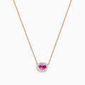 The 14K Rose Gold Pink Sapphire and Diamond Necklace features an oval pink sapphire pendant surrounded by a halo of white diamonds, elegantly displayed against a white background.