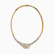 The Signature 14K Yellow Gold Emerald, Black and White Diamond Necklace features a panther-inspired design with a gold body encrusted in black and white diamonds for a stunning spotted pattern, accented by vivid emerald eyes.