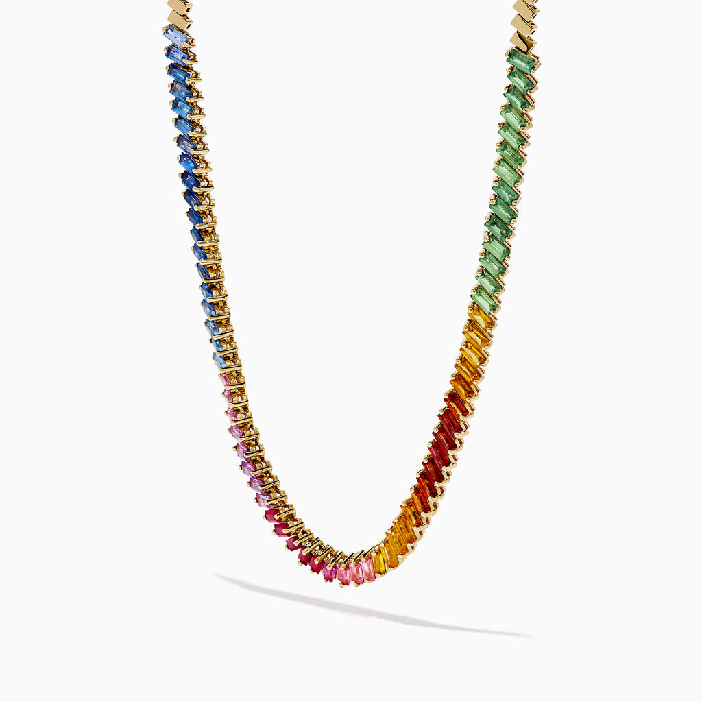 The Watercolors 14K Yellow Gold Multi Color Sapphire Tennis Necklace showcases a rainbow gradient of rectangular sapphires—blue, green, yellow, orange, and pink—set in yellow gold against a white background.