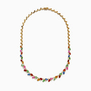 The Watercolors 14K Yellow Gold Multi Sapphire and Diamond Necklace features sapphires in pink, green, orange, blue, and red arranged in a delicate, symmetrical design along the chain.