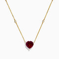 The Bordeaux 14K Yellow Gold Garnet and Diamond Heart Necklace features a heart-shaped red garnet pendant accented by two round diamonds on a delicate gold chain.