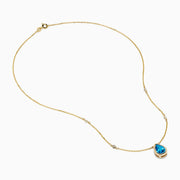 The Ocean Bleu 14K Yellow Gold Blue Topaz and Diamond Necklace features a teardrop blue topaz pendant with two round diamonds set on a delicate chain, shown on a white background.