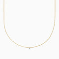 The 14K Yellow Gold Floating Diamond Solitaire Beaded Chain Necklace showcases a small round diamond pendant at the center, set against a plain white background.