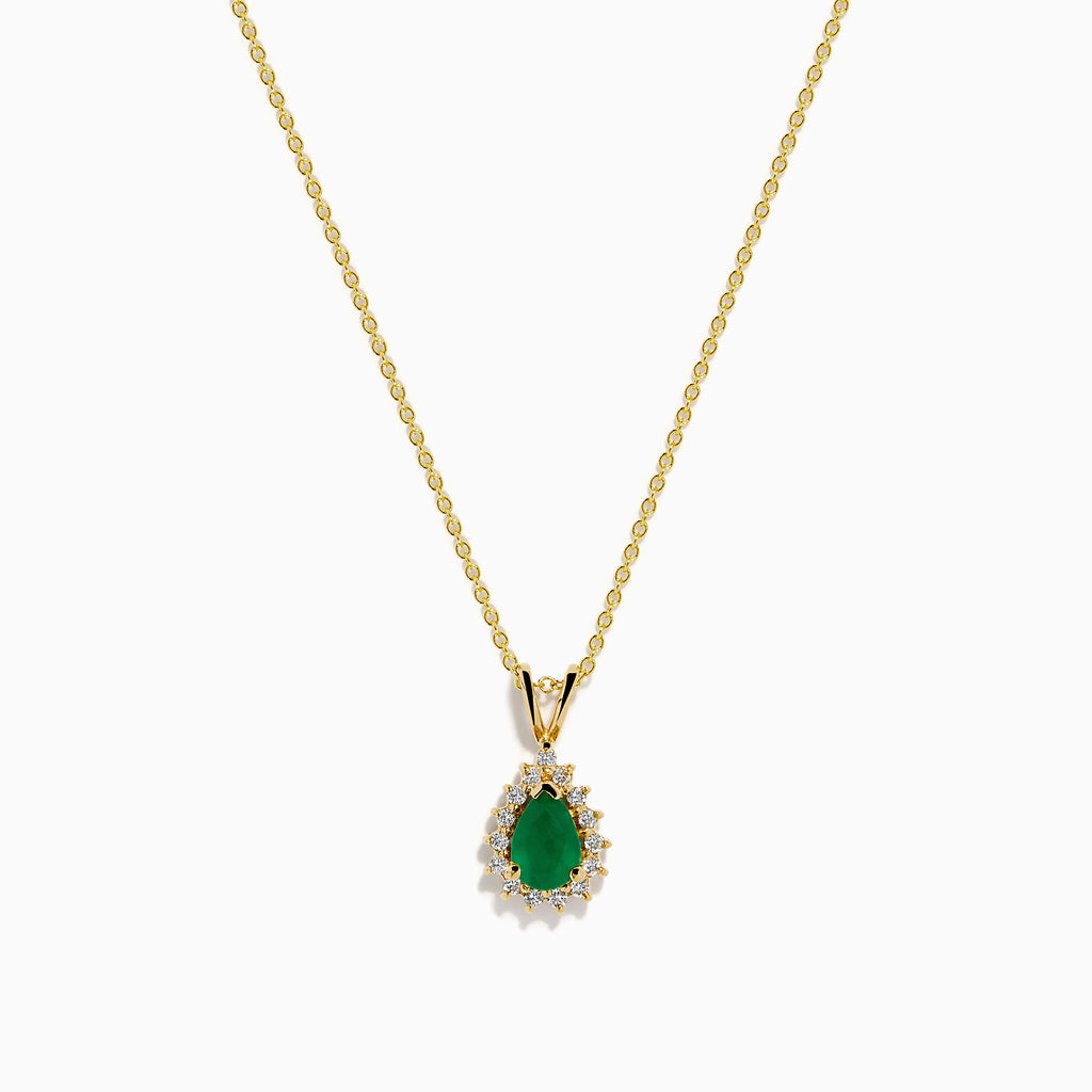The 14K Yellow Gold Emerald and Diamond Pear Halo Pendant features an emerald teardrop surrounded by a diamond halo, set on a gold chain.
