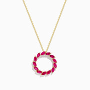 The Ruby Royale 14K Yellow Gold Marquise Cut Ruby Circle Pendant features a circular design with marquise-cut rubies in a wreath-like arrangement.