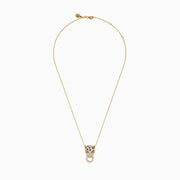The Signature 14K Yellow Gold Diamond and Emerald Panther Pendant features a panther adorned with diamonds and emeralds, its mouth gripping a diamond-studded circular ring, suspended from a yellow gold chain necklace.