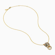 The Signature 14K Yellow Gold Diamond and Emerald Panther Pendant features a panther adorned with diamonds and emeralds, its mouth gripping a diamond-studded circular ring, suspended from a yellow gold chain necklace.
