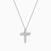 The 14K White Gold Diamond Cross Pendant features a delicate white gold chain and a cross encrusted with sparkling round diamonds, shown against a plain white background.