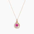 The 14K Rose Gold Pink Sapphire and Diamond Swirl Pendant features a teardrop swirl design with a central pink sapphire encircled by two rows of sparkling white diamonds.