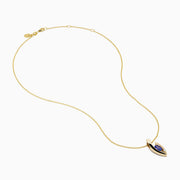 The Nahla Effy 14K Yellow Gold Pendant features a modern abstract design with an oval blue tanzanite gemstone and a small diamond accent.