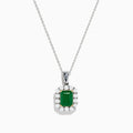 The Brasilica 14K Two-Tone Gold Emerald and Diamond Pendant features a rectangular emerald framed by sparkling diamonds, offering an elegant look reminiscent of a classic diamond pendant against a plain white background.