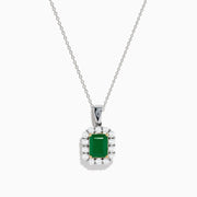 The Brasilica 14K Two-Tone Gold Emerald and Diamond Pendant features a rectangular emerald framed by sparkling diamonds, offering an elegant look reminiscent of a classic diamond pendant against a plain white background.
