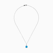This 14K white gold blue topaz and diamond pendant features a round, vibrant blue topaz and dazzling diamonds set on the bail.