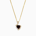 The 14K Yellow Gold Garnet and Diamond Pendant features a deep red, triangular garnet accented with small diamonds in a curved, asymmetrical design.