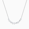 The Lab Grown Multi Shape Diamond Collarbone Necklace in 14K White Gold features a row of marquise and round lab grown diamonds arranged in a graceful curve along the center of the chain.