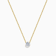 The Lab Grown Diamond 1.00ct Solitaire Pendant in 14K Yellow Gold features a single lab-grown diamond on a delicate gold chain, showcased against a white background.