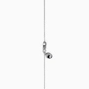 The Lab Grown Blue and White Diamond Halo Necklace in 14K White Gold features a round blue gemstone pendant surrounded by lab grown diamonds, plus two small clear stones set along the chain.