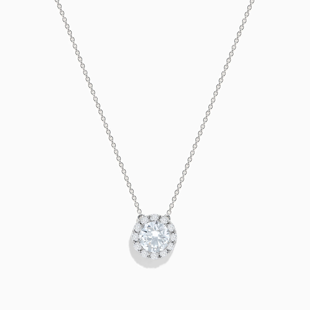 The 14K White Gold Lab Grown Diamond Pendant features a delicate silver chain and a round, sparkling lab grown diamond in an elegant white gold setting, shown against a white background.