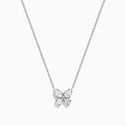 The Lab Grown Pear and Round Diamond Butterfly Pendant in 14K White Gold features four clear, pear-cut lab-grown diamonds set on a delicate silver chain, creating an elegant butterfly that sparkles beautifully.