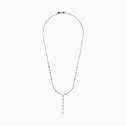 The Lab Grown Diamond Lariat Tennis Necklace in 14K White Gold showcases alternating round and rectangular lab grown diamonds, ending with a pear-shaped drop for an elegant, symmetrical look.