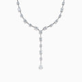 The Lab Grown Diamond Lariat Tennis Necklace in 14K White Gold showcases alternating round and rectangular lab grown diamonds, ending with a pear-shaped drop for an elegant, symmetrical look.