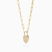 The Novelty 14K Yellow Gold Diamond Heart Lock Pendant is a yellow gold chain necklace with a diamond heart padlock, adorned with sparkling stones and a central keyhole design.