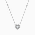 The Pave Classica 14K White Gold Diamond Heart Necklace features a heart-shaped pendant with a central diamond, surrounded by smaller diamonds, and two additional diamonds set along the chain.