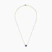 The Nahla 14K Yellow Gold Heart Tanzanite and Diamond Necklace features a heart-shaped blue tanzanite pendant accented with sparkling diamonds.