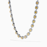 The Canare 18K Two Tone Gold White and Yellow Diamond Necklace showcases square yellow diamonds, each framed by small white diamonds, evenly set along the chain for a refined two-tone gold effect.
