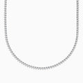 The Pave Classica 14K White Gold Diamond Tennis Necklace 6.81 TCW features evenly spaced round diamonds in a gentle curve, offering a sparkling, elegant look against a plain white background.