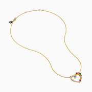 The 14K Yellow Gold Multi Sapphire and Diamond Open Heart Pendant features a heart-shaped design with one side adorned in diamonds and the other set with vibrant multicolored sapphires.