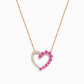 The 14K Rose Gold Pink Sapphire and Diamond Open Heart Necklace features a heart pendant, half set with white diamonds and half with vivid pink sapphires, shown on a plain white background.