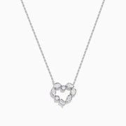 The Novelty 14K White Gold Multi Shape Diamond Heart Necklace features a heart pendant outlined with sparkling diamonds in various shapes, all set in elegant 14K white gold.