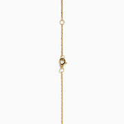 The 14K Yellow Gold Multi Shape Diamond Illusion Set Halo Pendant features a rectangular emerald-cut center with a diamond halo and a chain accented by evenly spaced round diamonds.