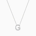 The 14K White Gold Diamond Initial G Pendant features a delicate white gold chain and a sparkling diamond-adorned G pendant, creating an elegant contrast against the plain white background.
