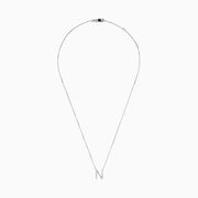 The 14K White Gold Diamond Initial N Pendant features a delicate white gold chain and a sparkling diamond-studded N, showcased on a plain white background.