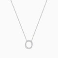 A 14K White Gold Diamond Initial O Pendant hangs delicately on a chain, featuring sparkling diamonds and displayed against a plain white background.