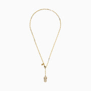 The Signature 14K Yellow Gold Diamond and Emerald Panther Necklace features a panther head pendant with diamond accents, emerald eyes, a circular ring in its mouth, an elongated link chain, and a small charm near the clasp.