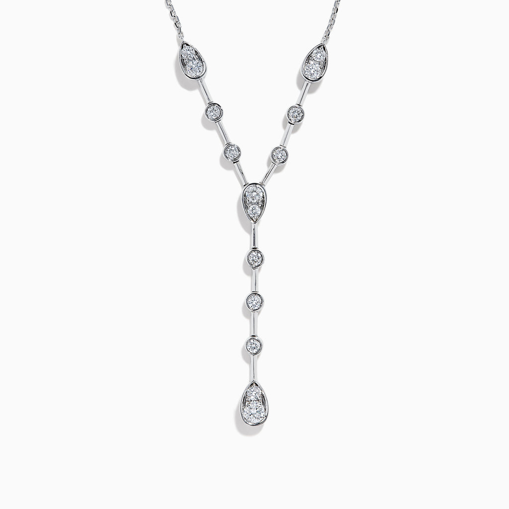 The 14K White Gold Bezel-Set Diamond Lariat Necklace showcases round and teardrop bezel-set diamonds in a Y-shaped design, all gracefully suspended from a delicate chain.