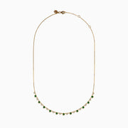 The 14K Yellow Gold Emerald and Diamond Bezel Set Station Necklace features alternating round emeralds and diamonds in bezel settings, evenly spaced along the front curve of the chain, displayed on a white background.