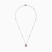 The 18K Two-Tone Gold Pink and White Diamond Pear Halo Pendant features sparkling pink and white diamonds on a two-tone gold design, creating an elegant halo look.