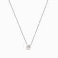 The 14K Two Tone Gold Diamond Solitaire Necklace features a single round-cut diamond in a classic prong setting, elegantly displayed at the center of a fine two-tone gold chain.