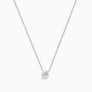 The 14K Two Tone Gold Diamond Solitaire Necklace features a single round-cut diamond in a classic prong setting, elegantly displayed at the center of a fine two-tone gold chain.