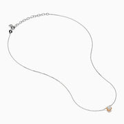 The 14K Two Tone Gold Diamond Solitaire Necklace features a single round-cut diamond in a classic prong setting, elegantly displayed at the center of a fine two-tone gold chain.
