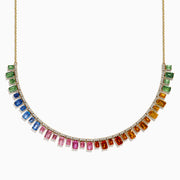 The 14K Yellow Gold Multi Sapphire and Diamond Collar Necklace showcases a curved row of white diamonds with green, blue, pink, orange, and yellow sapphires hanging below in a vibrant gradient design.