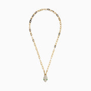 The 14K Yellow Gold White and Green Enamel Snake Paperclip Chain Necklace features a snake head pendant with white enamel scales and green accents, hanging elegantly from a sleek paperclip chain.